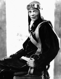 November 1928 --- Aviator Amelia Earhart poses in her flight suit in November, 1928, a few months after her solo crossing of the Atlantic Ocean. --- Image by © CORBIS
