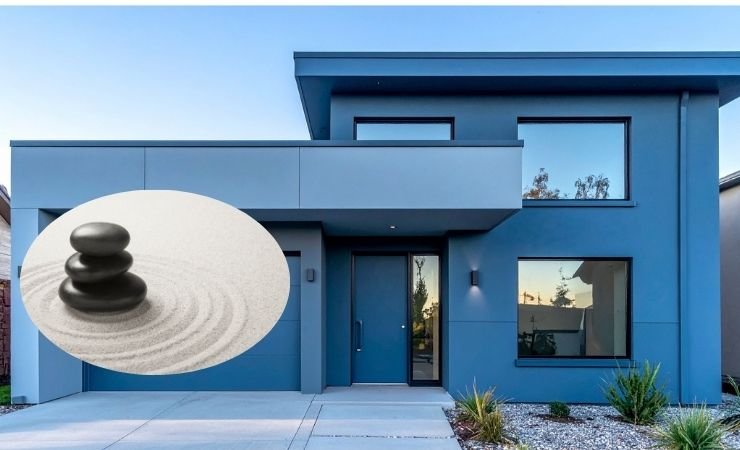 la facciata di una casa con dei sassolini accanto