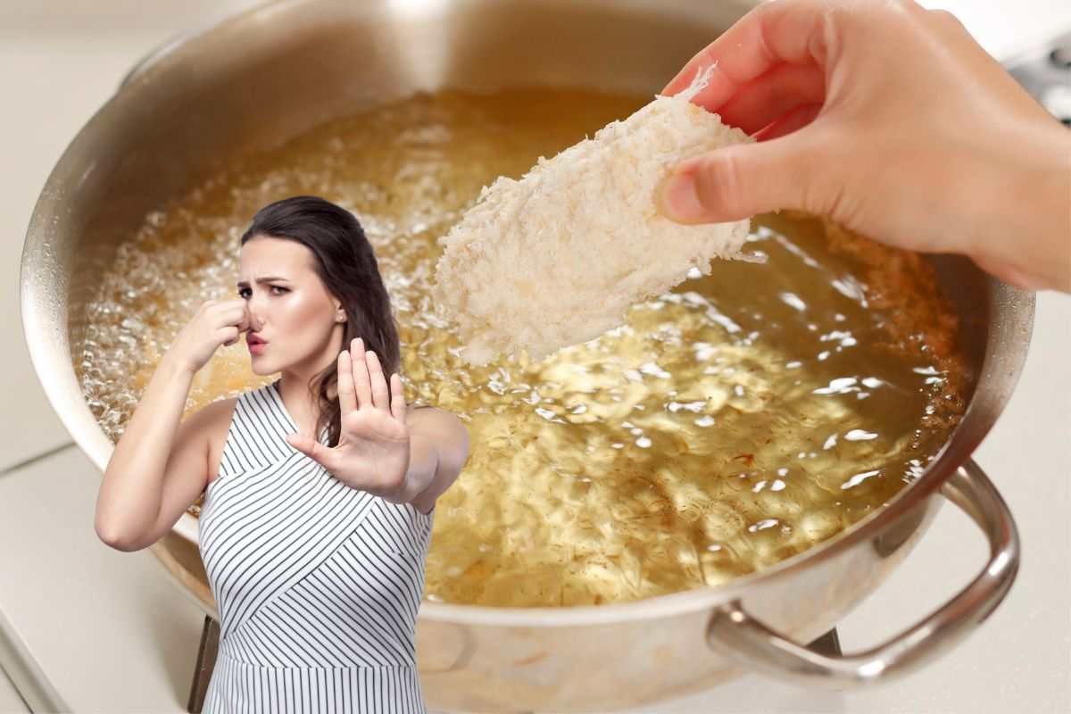 una persona che sta cuocendo dei fritti e un'altra che si tappa il naso