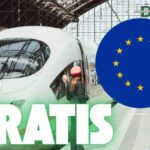 Simbolo Unione Europea, scritta "Gratis" e treno fermo in stazione