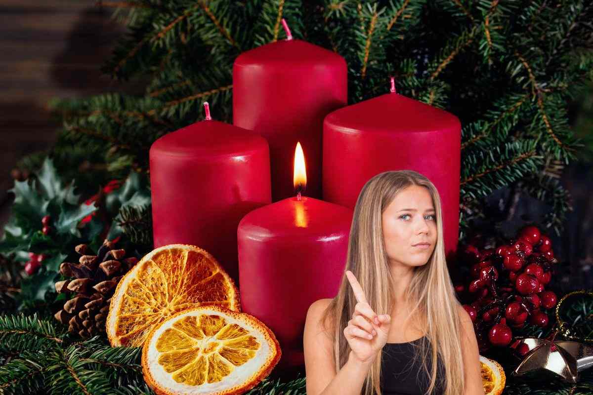candele rosse e una ragazza che fa no